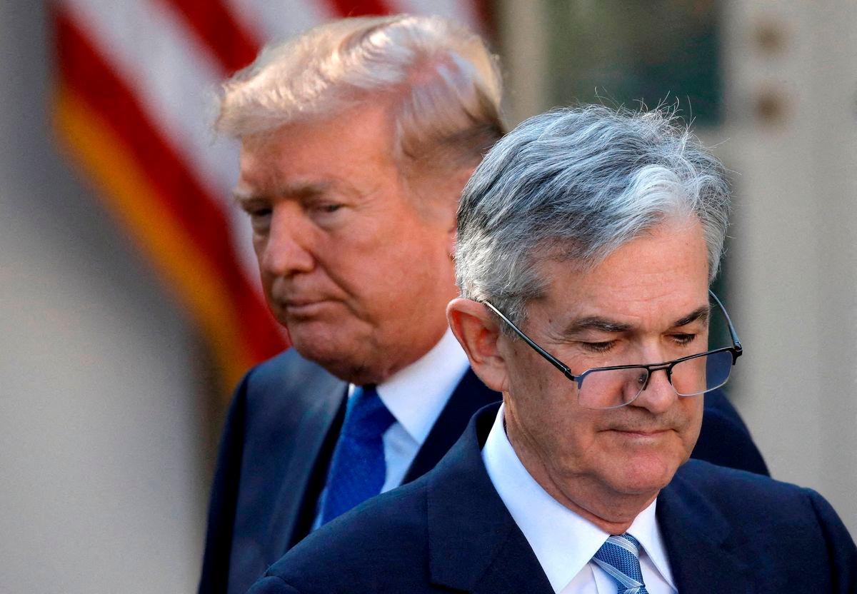 FILE PHOTO: U.S. President Donald Trump looks on as Jerome Powell, his nominee at the time to lead the U.S. Federal Reserve, moves to the podium at the White House in Washington, U.S., November 2, 2017. REUTERS