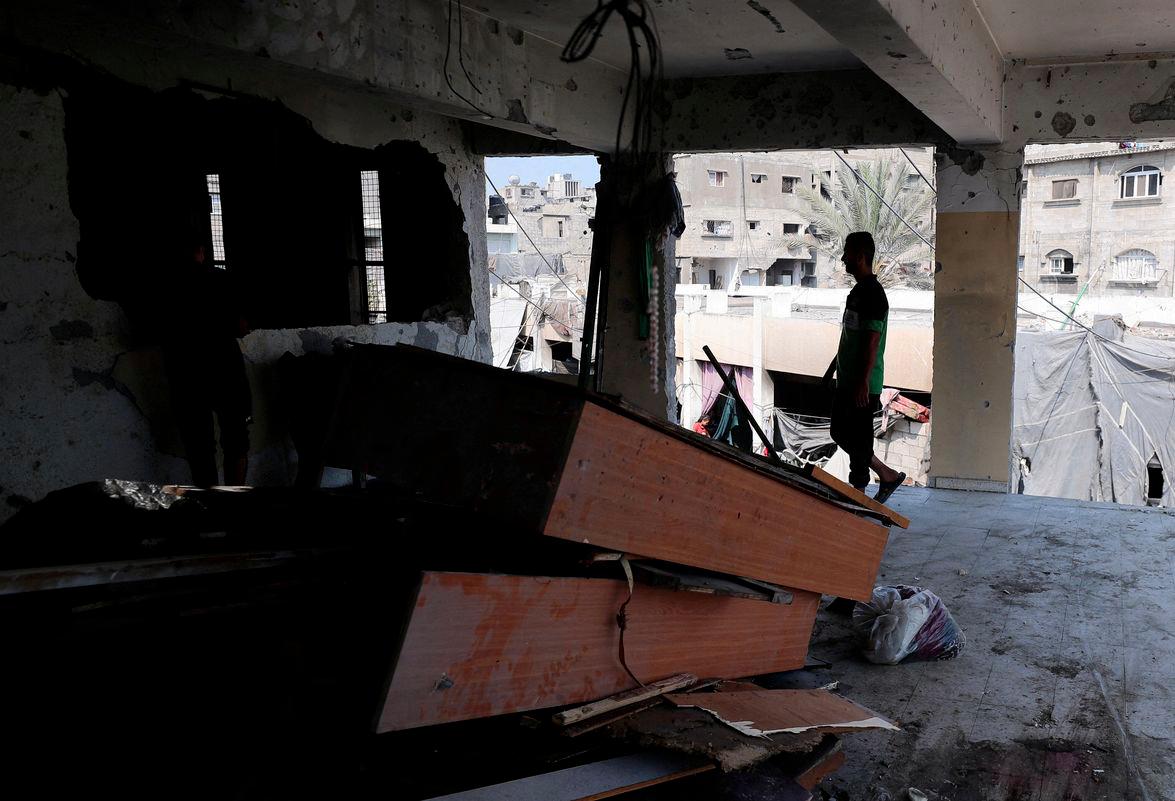 Palestinians inspect the damage following an overnight Israeli strike on a school sheltering displaced families, in Jabalia, in the northern Gaza Strip, July 11, 2025. - REUTERSPIX