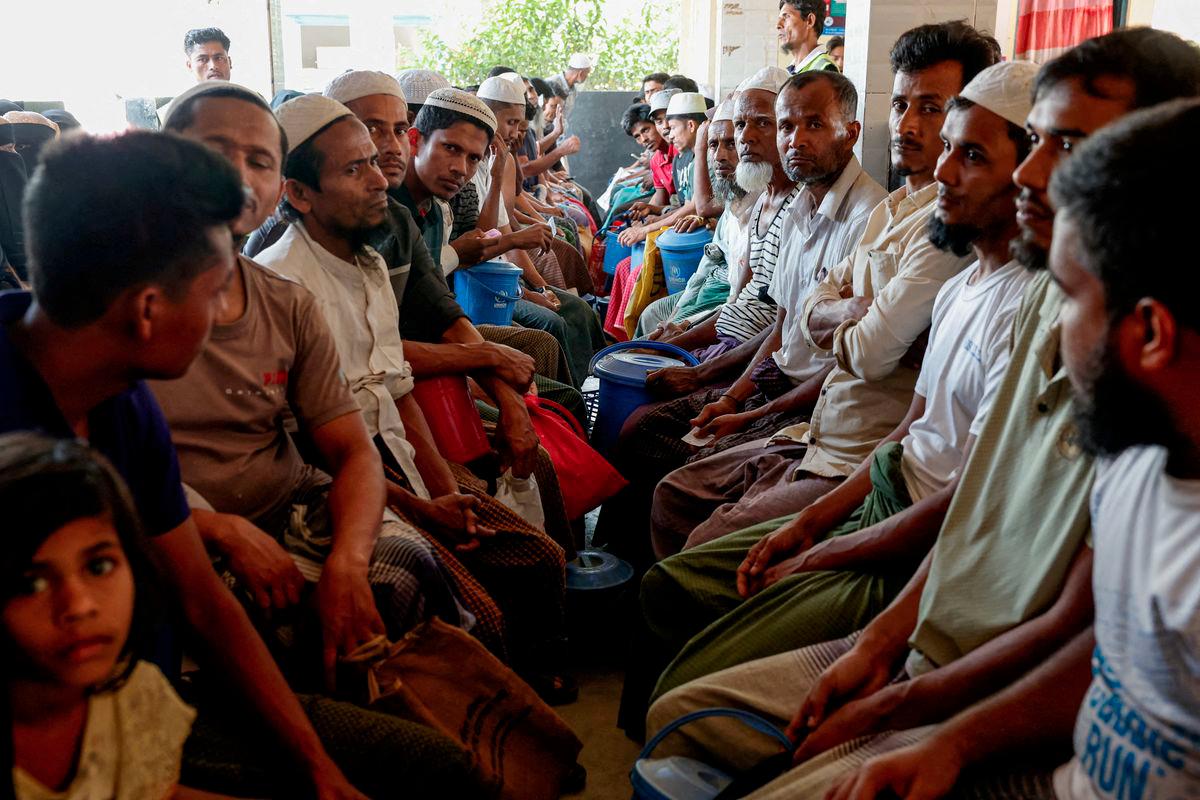 Rohingya refugees wait at the World Food Programme(WFP) distribution center to purchase grocery items, at the refugee camp in Cox's Bazar, Bangladesh, March 15, 2025. - REUTERSPIX