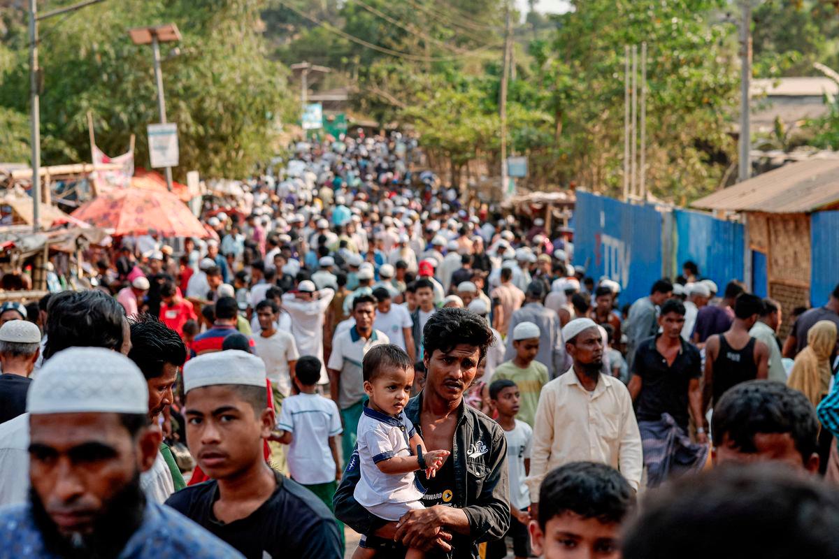 Rohingya refugees gather at roadside kitchen market, at the refugee camp in Cox's Bazar, Bangladesh, March 15, 2025. - REUTERSPIX