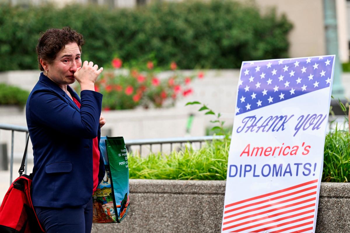 A woman cries during a sendoff event for State Department workers in Washington, D.C., U.S., July 11, 2025. REUTERS