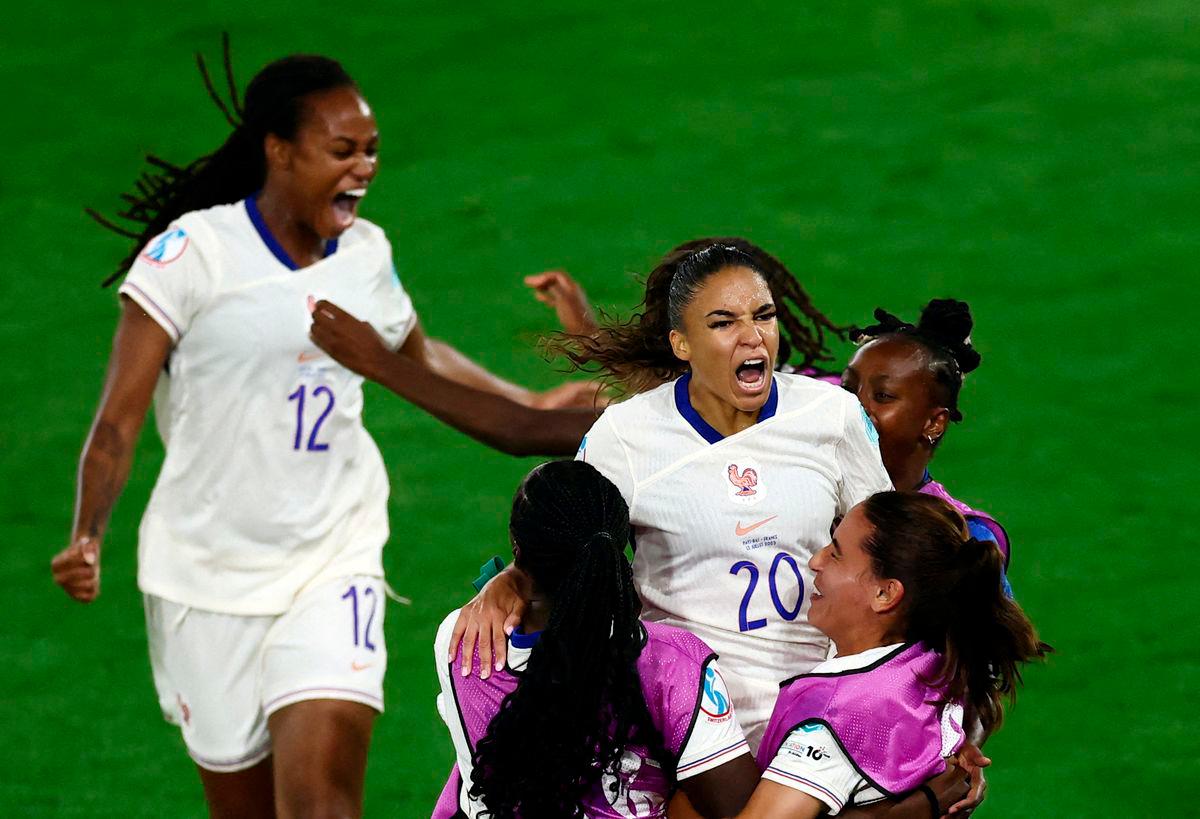 France’s Delphine Cascarino celebrates scoring their third goal with teammates REUTERS/Stephane Mahe TPX IMAGES OF THE DAY