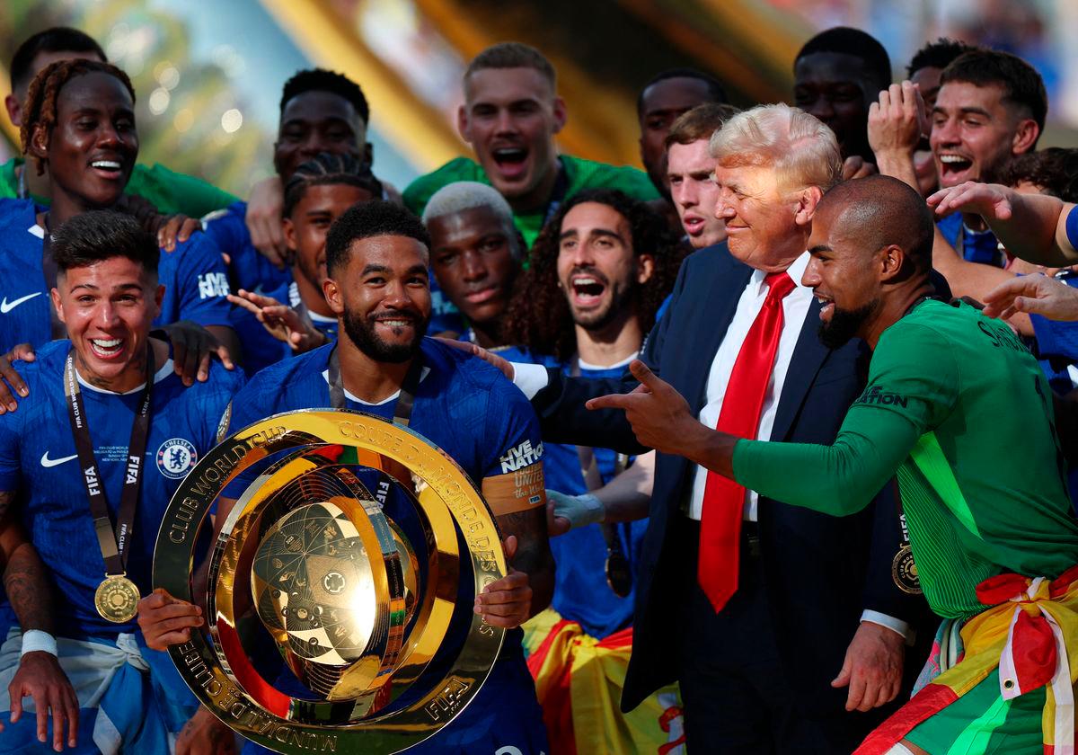 Chelsea’s Reece James and teammates celebrate with the trophy alongside U.S. President Donald Trump after winning the FIFA Club World Cup - REUTERS