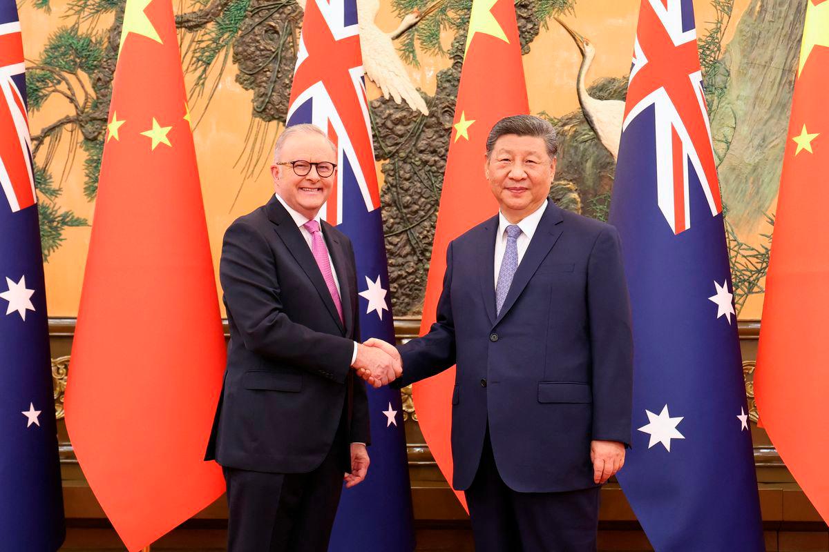 Chinese President Xi Jinping and Australian Prime Minister Anthony Albanese shake hands at the Great Hall of the People in Beijing - China Daily via REUTERSPix