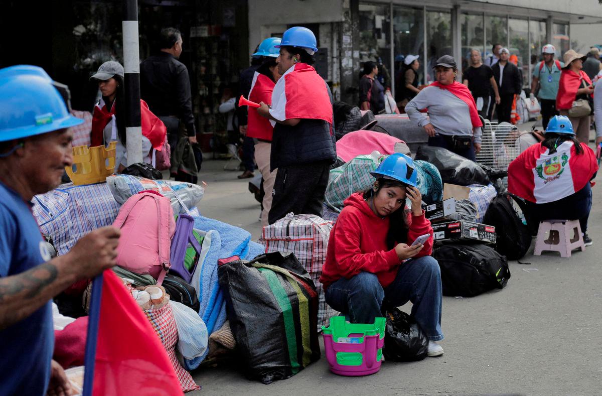 Informal artisanal miners stand near Congress as they take part in a protest to pressure the Peruvian government to extend the deadline to formalize informal mining operations, in Lima, Peru July 3, 2025. - REUTERSPIX