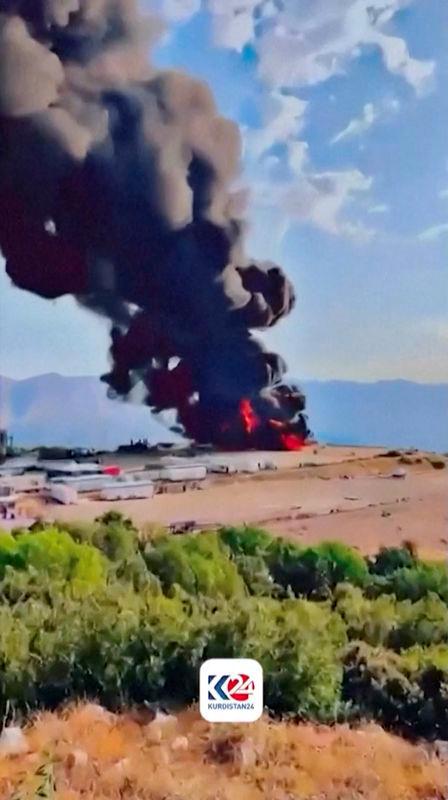 Black smoke rises from a roaring fire at Sarsang oilfield, following a drone attack, in Dohuk, Iraq July 15, 2025, in this screen grab taken from a handout video. KURDISTAN 24/Handout via REUTERSPIX
