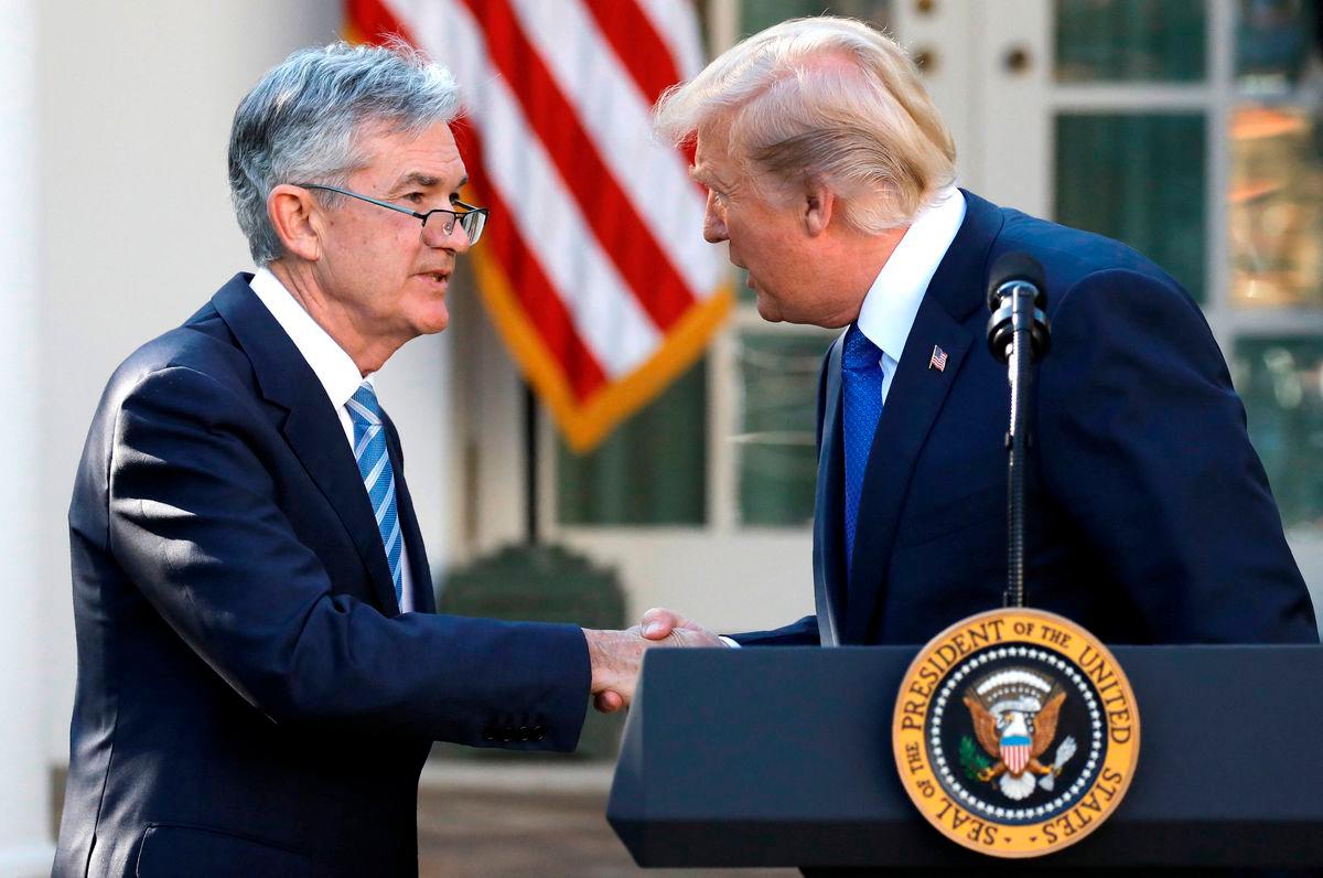FILE PHOTO: U.S. President Donald Trump arrives shakes hands with Jerome Powell, his nominee to become chairman of the U.S. Federal Reserve at the White House in Washington, U.S., November 2, 2017. REUTERS
