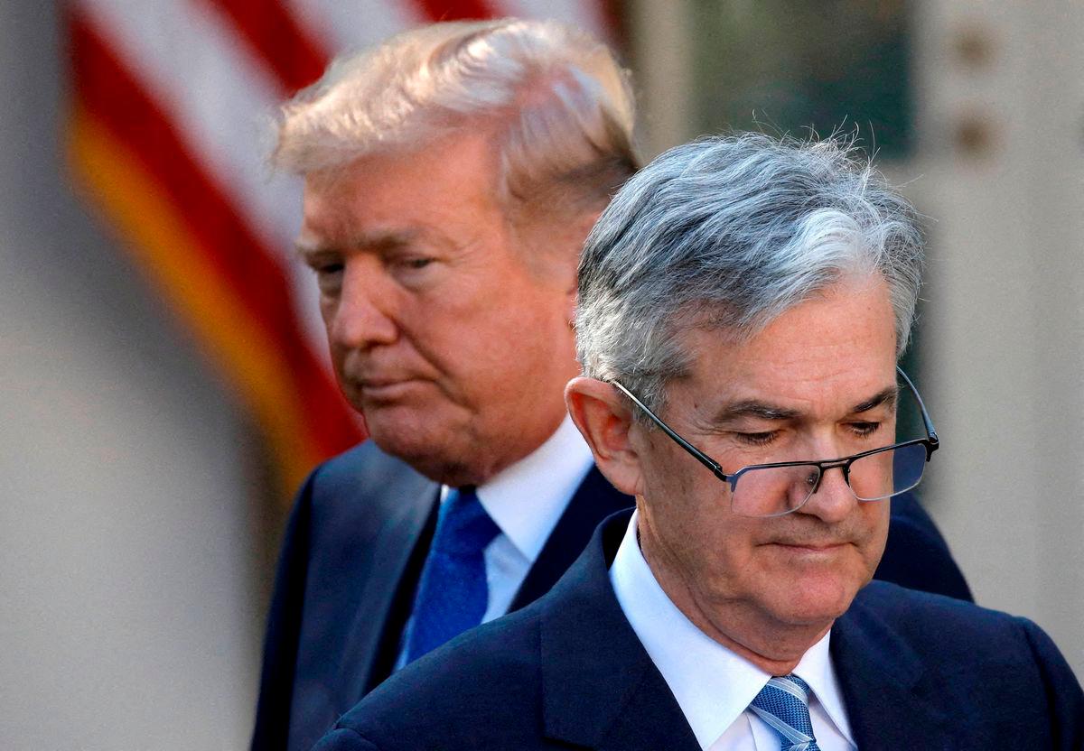 FILE PHOTO: U.S. President Donald Trump looks on as Jerome Powell, his nominee at the time to lead the U.S. Federal Reserve, moves to the podium at the White House in Washington, U.S., Nov 2, 2017 - REUTERS