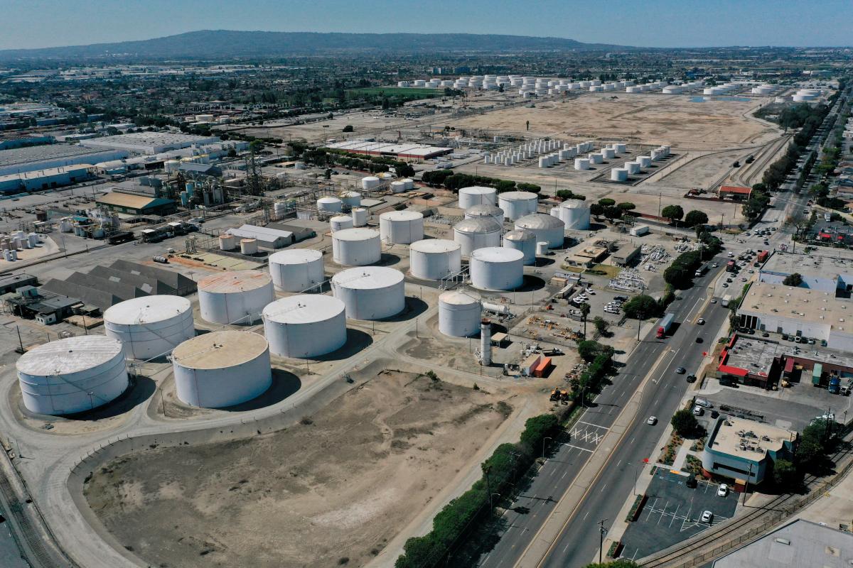 FILE PHOTO: An aerial view of storage tanks at the Kinder Morgan Watson Station, a gathering system for oil and refined petroleum product pipelines, in Long Beach, California, U.S., March 11, 2022. Picture taken with a drone. REUTERS