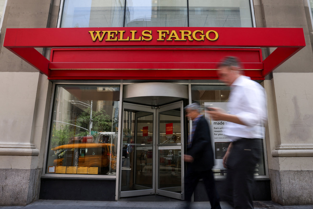People walk by a Wells Fargo bank branch in New York City, U.S., June 4, 2025. - REUTERS