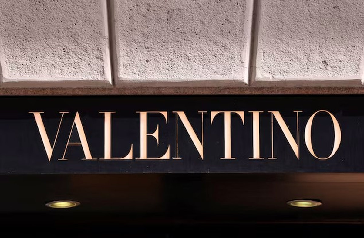 The logo of fashion house Valentino is seen outside a shop in Milan, Italy, April 8, 2024. - REUTERS