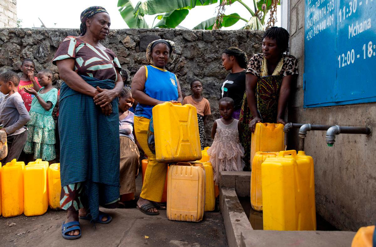 Women and children queue at the standpipe, where incomplete water connections caused by USAID funding cuts to the NGO Mercy Corps have led to ongoing water shortages, in Goma, North Kivu province, Democratic Republic of Congo, June 16, 2025. REUTERS