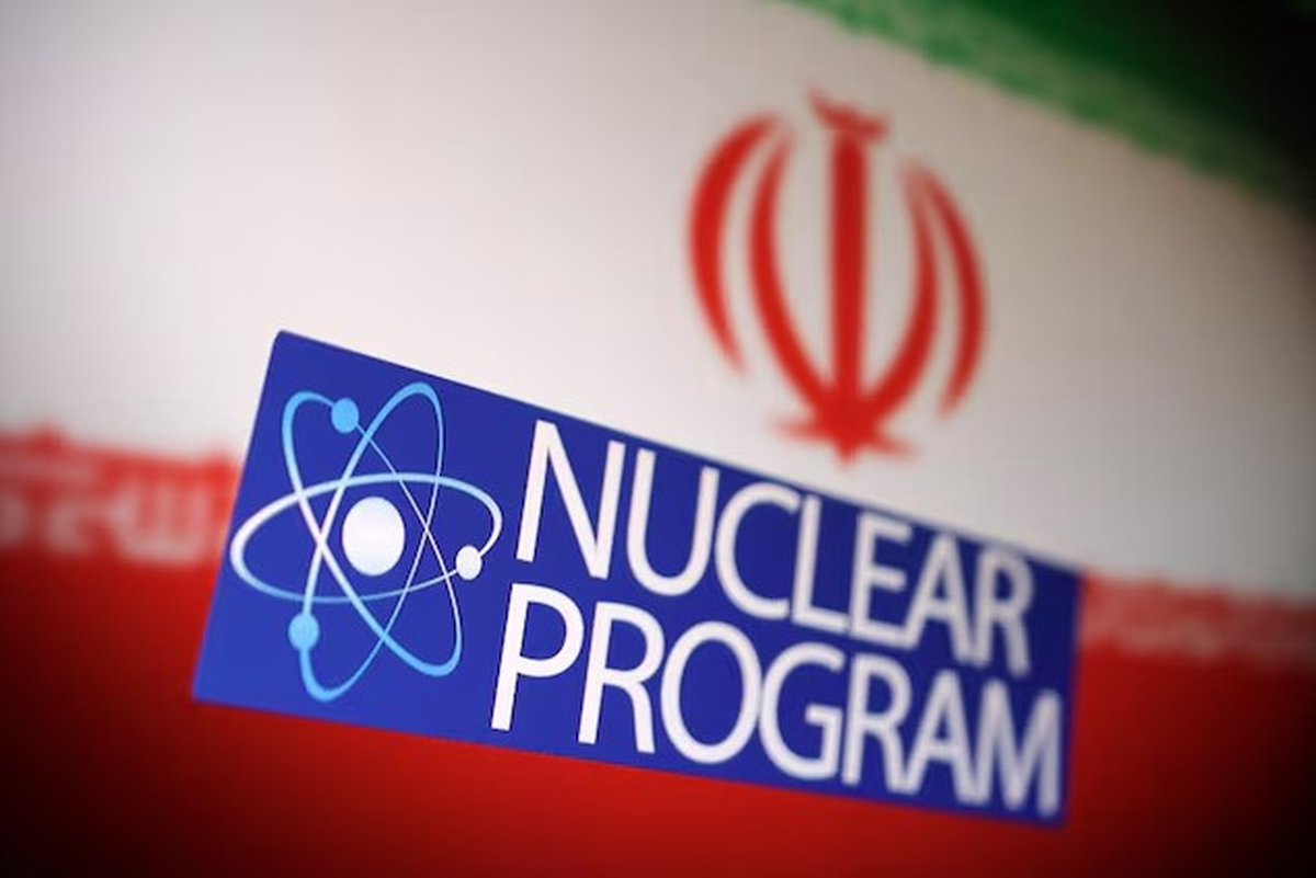 Iranian flag, atom symbol and words “Nuclear program” are in this illustration taken June 16, 2025. - REUTERS