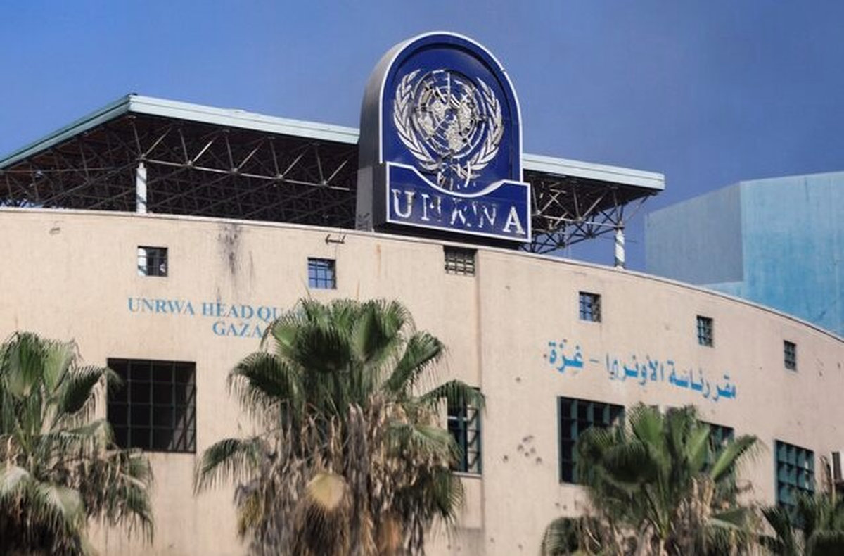 A damaged sign is pictured at the headquarters of UNRWA, following an Israeli raid, amid the Israel-Hamas conflict, in Gaza City, July 12, 2024. - REUTERS