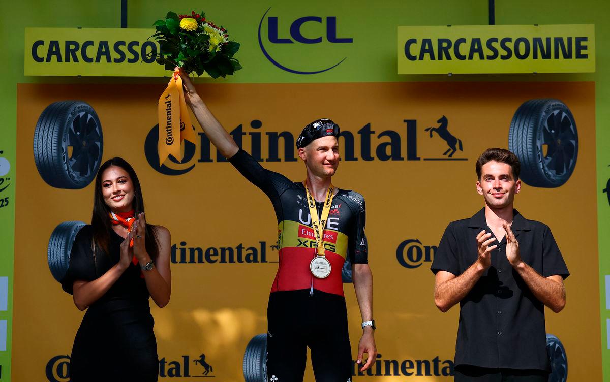 UAE Team Emirates XRG’s Tim Wellens celebrates on the podium after winning stage 15 REUTERS