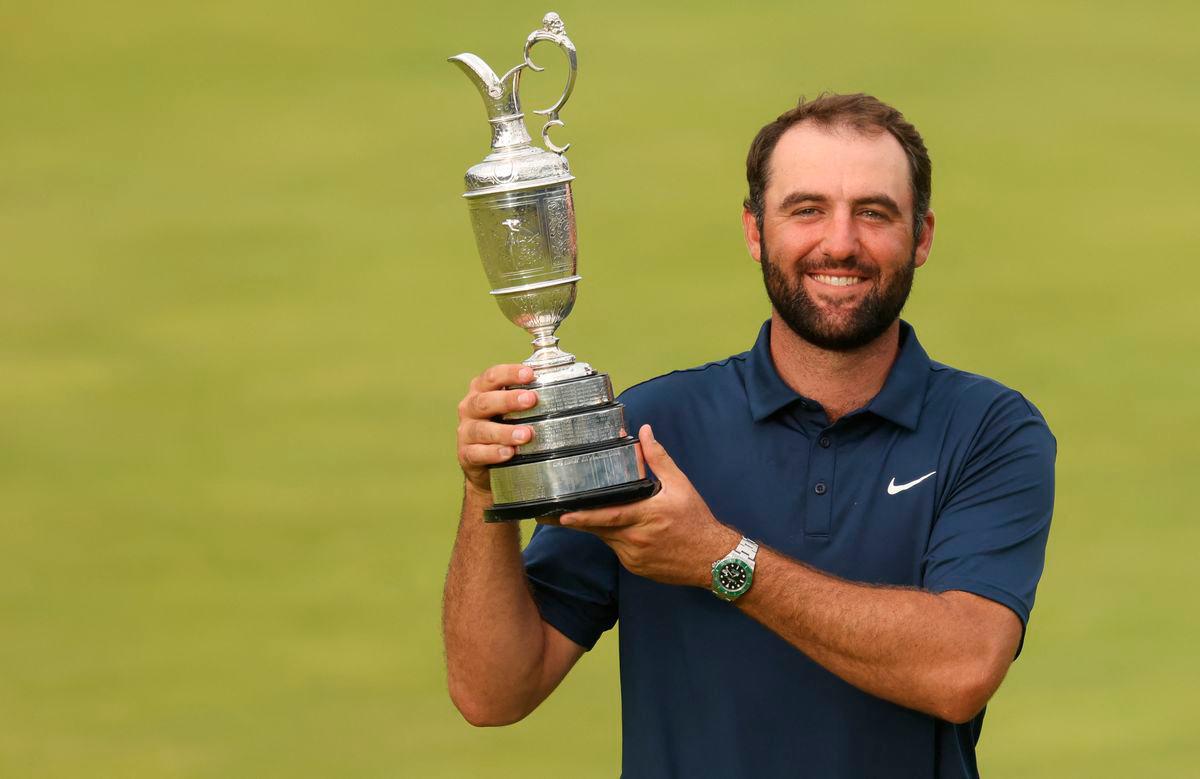 Scottie Scheffler celebrates with the Claret Jug after winning the 153rd Open Championship golf tournament at Royal Portrush. Mike Frey-Imagn Images