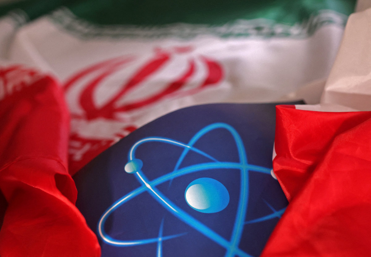 Atomic symbol and Iranian flag are seen in this illustration taken September 8, 2022. - REUTERS