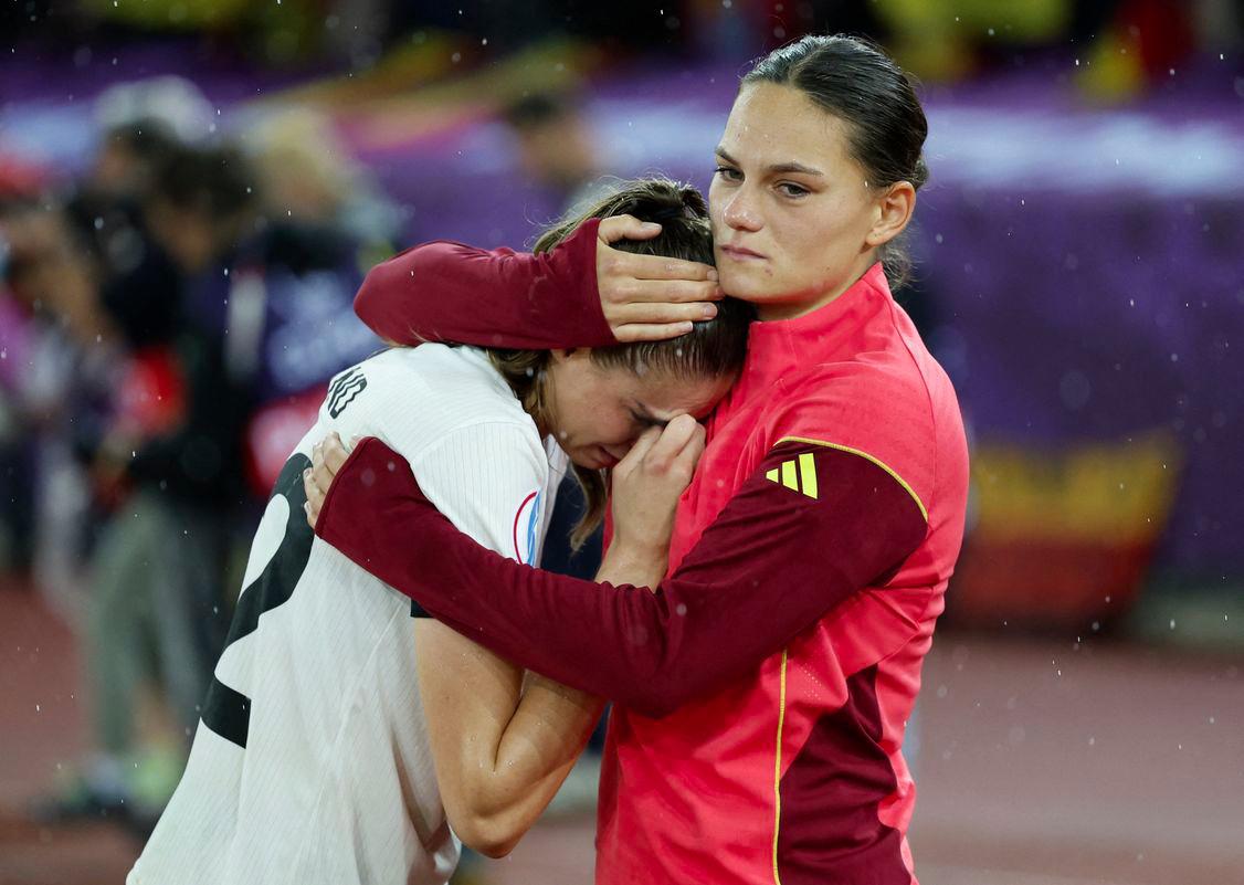 Football - UEFA Women's Euro 2025 - Semi Final - Germany v Spain - Stadion Letzigrund, Zurich, Switzerland - July 23, 2025 Germany's Jule Brand and Germany's Giovanna Hoffmann look dejected after the match - REUTERSPIX