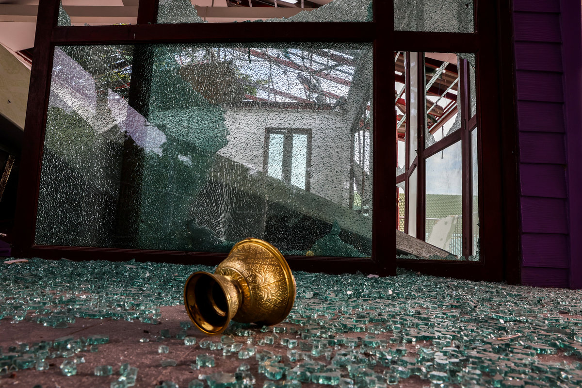 Broken glass lies on the ground inside a damaged building inside Phanom Dong Rak Hospital, following being hit by Cambodia's artillery, after Thailand scrambled an F-16 fighter jet to bomb targets in Cambodia on Thursday after artillery volleys from both sides killed civilians, in Surin, Thailand, July 25, 2025. - REUTERS