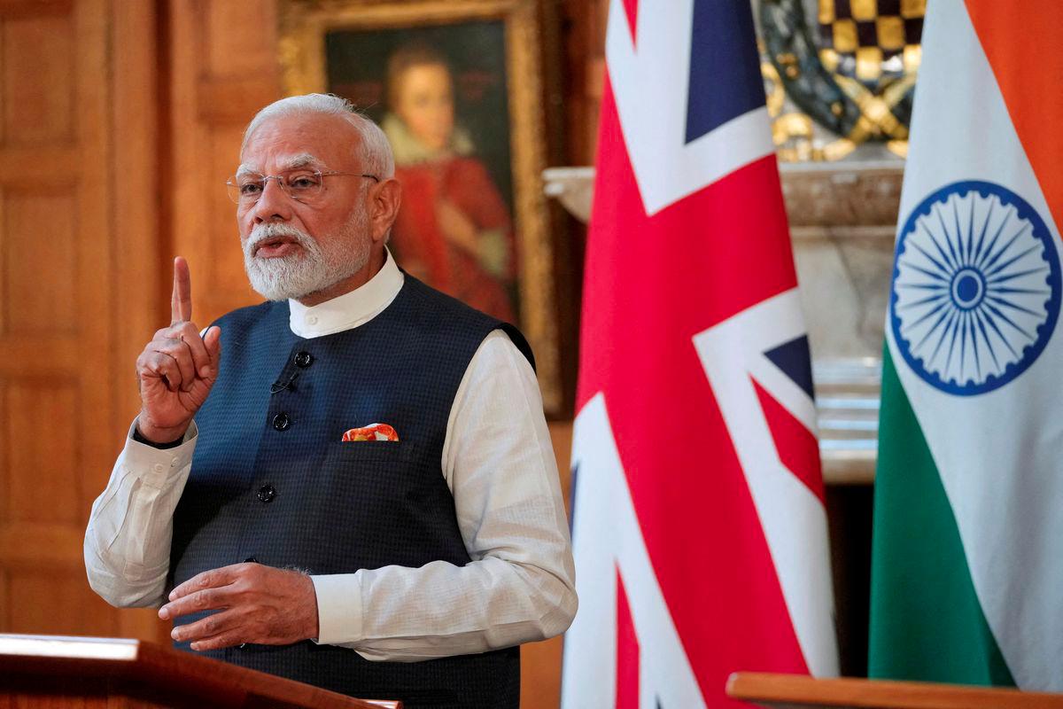 Prime Minister Narendra Modi of India gestures during a press conference with Britain's Prime Minister Keir Starmer (not pictured) after signing a free trade agreement at Chequers near Aylesbury, England, Thursday, July 24, 2025. - Kin Cheung/Pool via REUTERSPIX