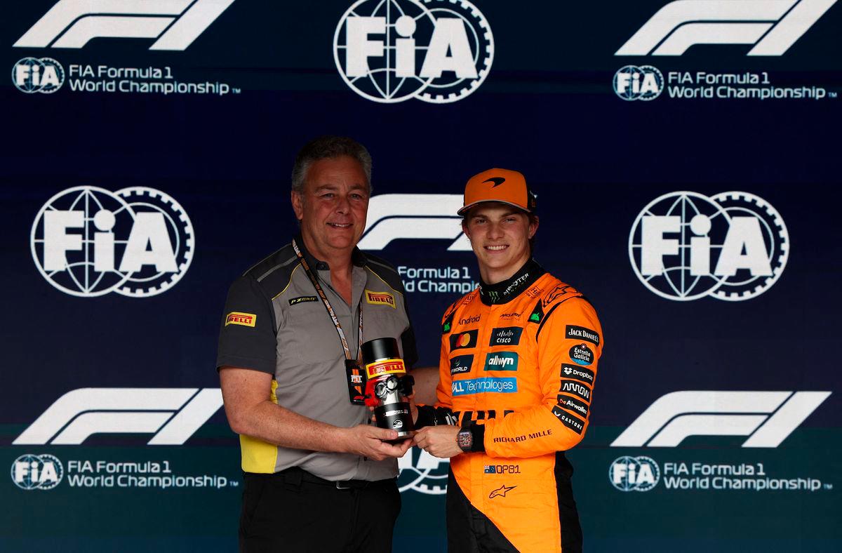 McLaren’s Oscar Piastri poses with a trophy after qualifying in pole position for the sprint race - REUTERS