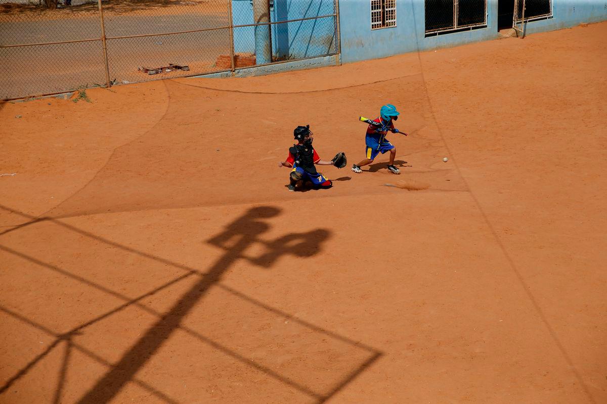 FILE PHOTO: Players from Cacique Mara Little League baseball team, practice during training at Cacique Mara stadium in Maracaibo, Venezuela, August 30, 2019- REUTERS