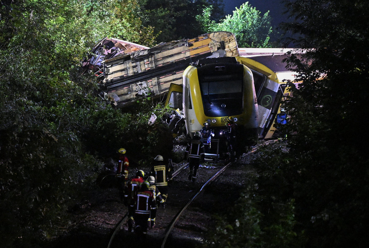 Emergency personnel work at the site where a local train derailed causing the death of several passengers, in Riedlingen near Biberach, Germany, July 27, 2025. - REUTERS