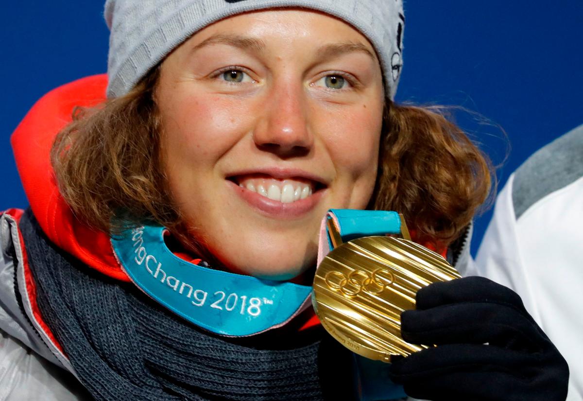 Gold medallist Laura Dahlmeier of Germany on the podium- REUTERS