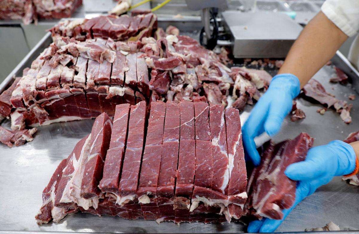 An employee works at the assembly line of jerked beef at a plant of JBS S.A, the world’s largest beef producer, in Santana de Parnaiba - Reuterspix