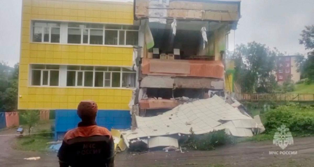 Am emergency services worker looks at a kindergarten damaged by an earthquake, in Petropavlovsk-Kamchatsky, Kamchatka Krai, Russia, July 30, 2025 in this screen grab from handout video. - Russian Ministry for Emergencies/Handout via REUTERSPIX
