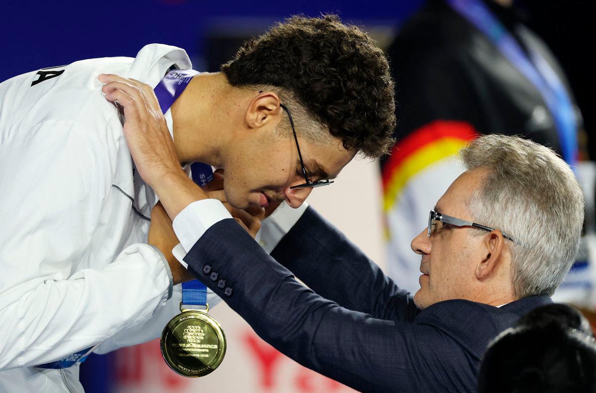Gold medallist Tunisia’s Ahmed Jaouadi celebrates on the podium during the medal ceremony - REUTERS