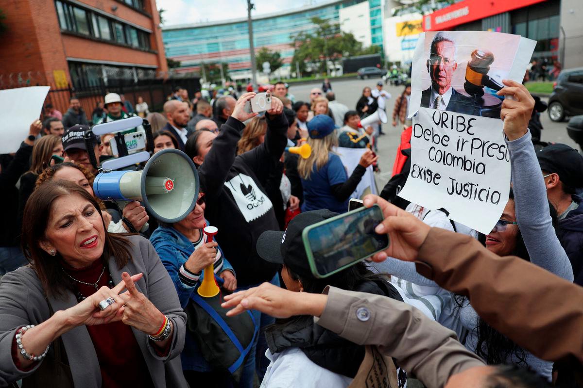 Supporters of former Colombia’s President Alvaro Uribe face people protesting against him outside the Paloquemao judicial complex, following his criminal conviction and sentence of 12 years of house arrest, in Bogota, Colombia - Reuterspix