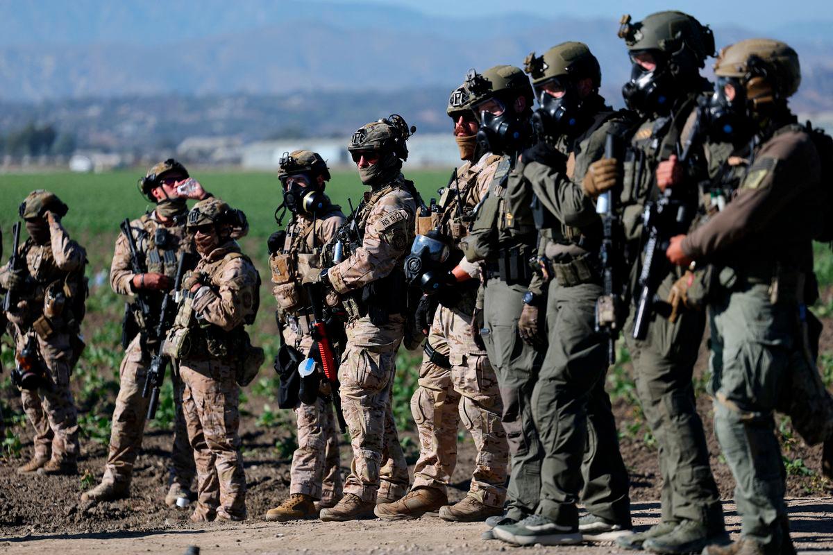 U.S. federal agents stand guard while blocking a road leading to an agricultural facility where U.S. federal agents and immigration officers carried out an operation, in Camarillo, California, U.S., July 10, 2025. - REUTERSPIX