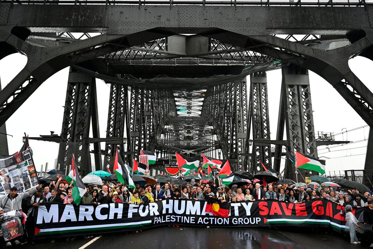 Protesters walk across the Sydney Harbour Bridge during the Palestine Action Group’s March for Humanity in Sydney, Australia, August 3, 2025. AAP/Dean Lewins via REUTERS
