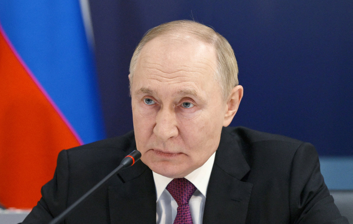 Russian President Vladimir Putin takes part in a video link to observe major naval drills, which are conducted by the Russian Navy in the Pacific and Arctic oceans and in the Baltic and Caspian seas, during his visit to the Admiralty in Saint Petersburg, Russia, July 27, 2025. - Pool via REUTERS