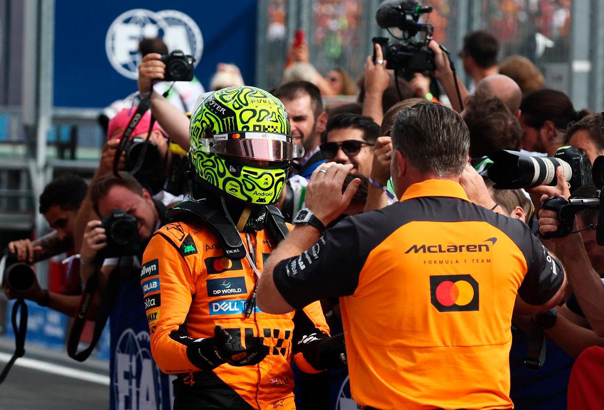 McLaren’s Lando Norris celebrates with McLaren chief executive Zak Brown after winning the Hungarian Grand Prix - Reuters