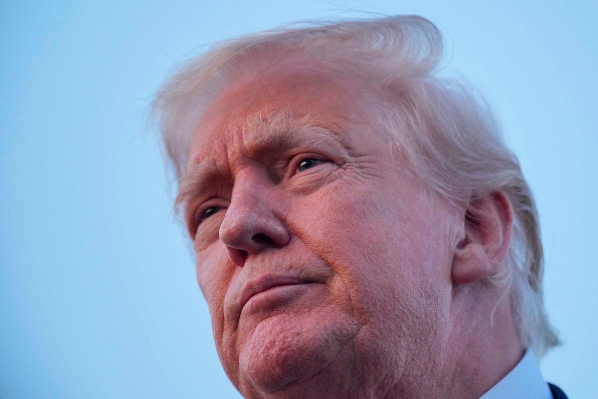 U.S. President Donald Trump looks on as he talks to members of the press at Lehigh Valley International Airport in Allentown, Pennsylvania, U.S., August 3, 2025. REUTERS/Ken Cedeno