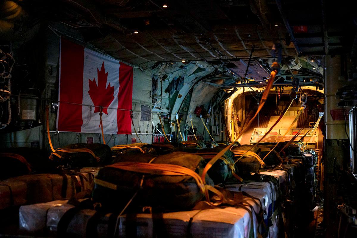 Pallets are prepared on a Royal Canadian Air Force CC-130 Hercules transport aircraft before airdropping some of approximately 21,600 lbs of humanitarian aid over the Gaza Strip, at Queen Alia International Airport in Amman, Jordan August 4, 2025. - Corporal Marc-Andre Leclerc/Canadian Forces/Handout via REUTERSPIX