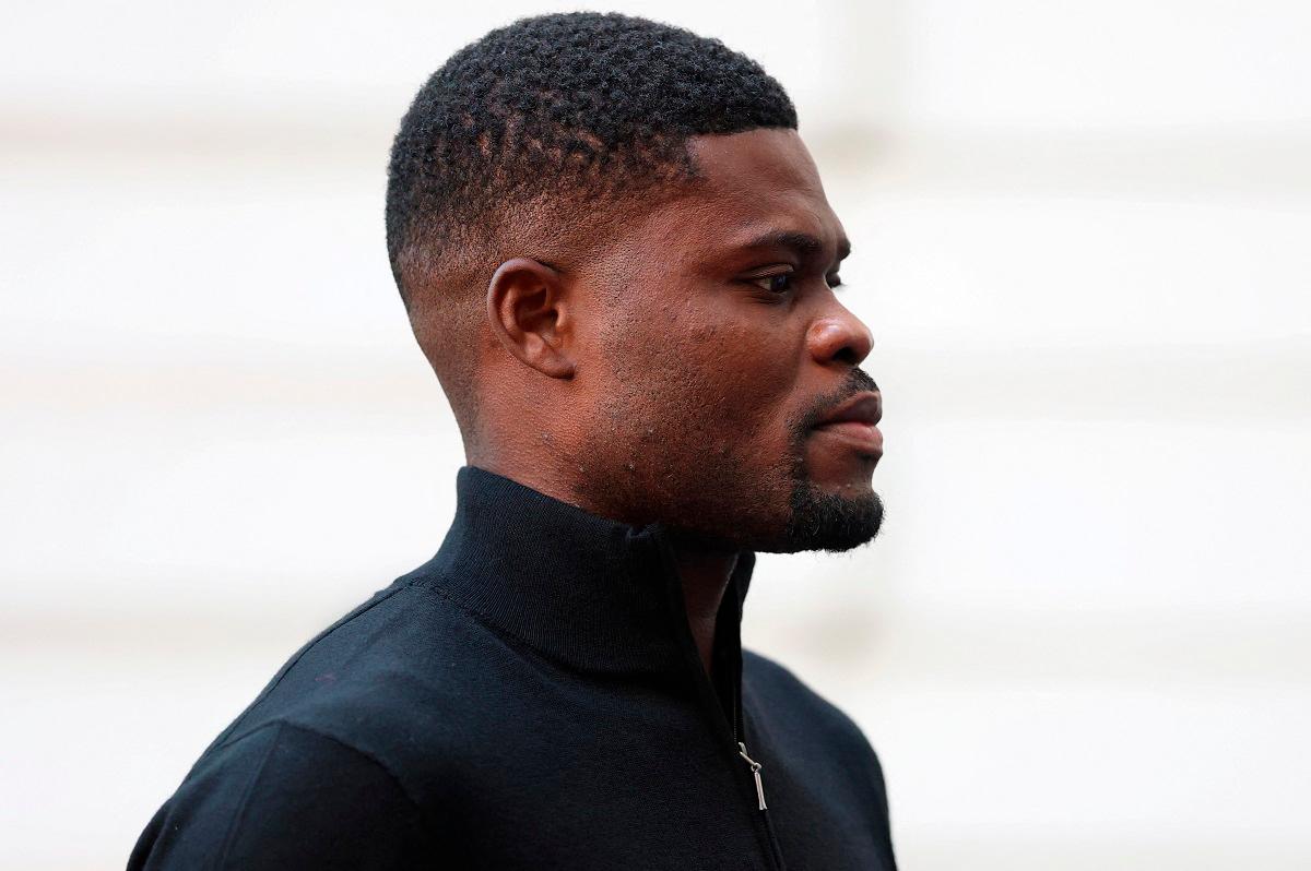 Former Arsenal player Thomas Partey, who has been charged with five counts of rape and one count of sexual assault, walks outside Westminster Magistrates’ Court, in London, Britain, August 5, 2025. - REUTERS/Hannah McKay