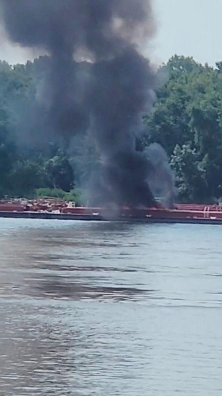 Smoke rises after a helicopter crashed into a barge on the Mississippi River in Alton, Illinois, U.S. August 7, 2025 in this screen grab from video. - Adam Briggs/TMX/via REUTERSPIX