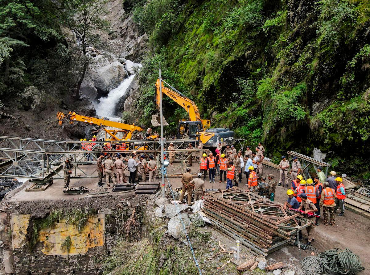 A drone view of Border Roads Organisation (BRO) and State Disaster Response Force (SDRF) officials attempting to build a makeshift bridge to reach Dharali village after the bridge connecting it was swept away during landslides in Gangnani, Uttarakhand, India, August 8, 2025. Francis Mascarenhas /REUTERS