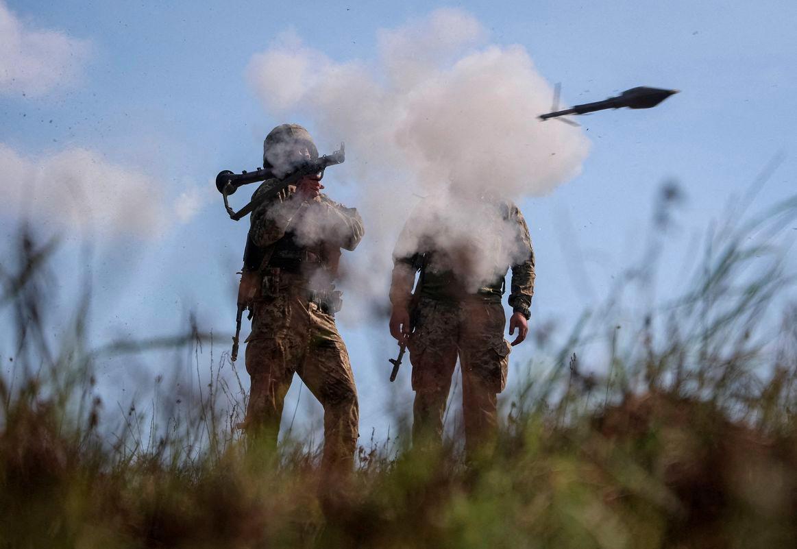 Servicemen of the 115th Separate Mechanized Brigade of the Ukrainian Armed Forces use an RPG-7 grenade launcher during a training between combat missions at a training ground, amid Russia's attack on Ukraine, in Kharkiv region, Ukraine August 8, 2025. - REUTERSPIX