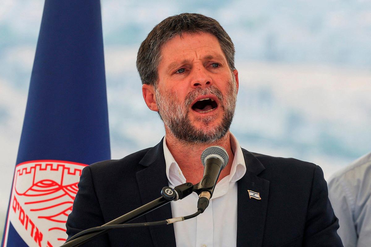 Israeli Finance Minister Bezalel Smotrich speaks at a press conference regarding settlements expansion for the long-frozen E1 settlement, that would split East Jerusalem from the occupied West Bank, near the Israeli settlement of Maale Adumim in the Israeli-occupied West Bank, August 14, 2025. - REUTERS/Ronen Zvulun