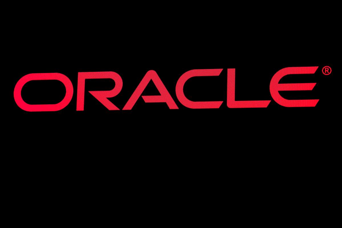 The company logo for Oracle Corp. is displayed on a screen. Reuterspix