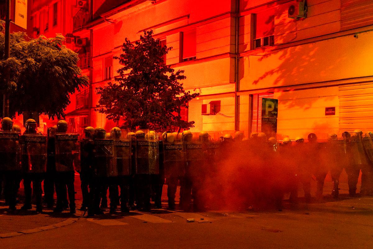 Police officers stand guard during a standoff between ruling party supporters and anti-government protesters in Novi Sad, Serbia. Reuterspix