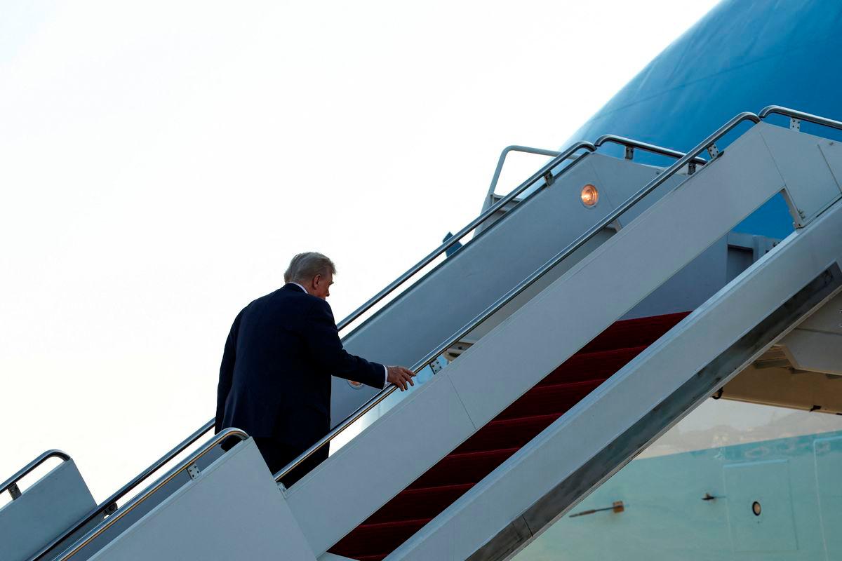 U.S. President Donald Trump boards Air Force One as he departs for Alaska to meet with Russian President Vladimir Putin to negotiate for an end to the war in Ukraine, from Joint Base Andrews in Maryland, U.S., August 15, 2025. REUTERS/Kevin Lamarque