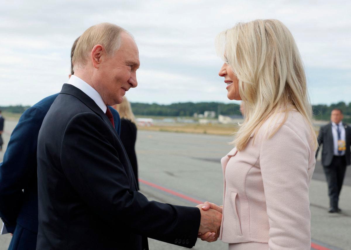 Russian President Vladimir Putin shakes hands with Chief of Protocol of the United States Monica Crowley upon departure following his meeting with U.S. President Donald Trump in Anchorage, Alaska, U.S., August 15, 2025. Sputnik/Gavriil Grigorov/Pool via REUTERS
