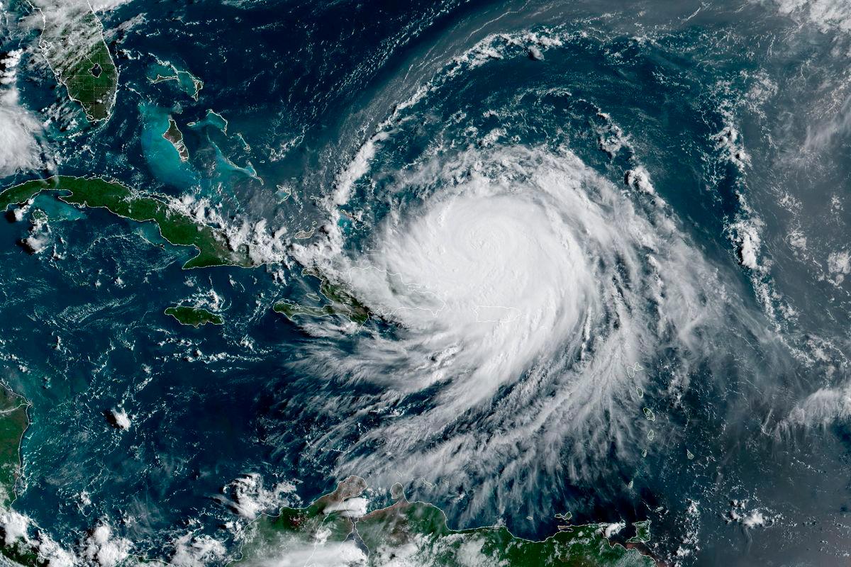 Hurricane Erin, which is the first hurricane of the 2025 Atlantic season and has been downgraded to Category 3, moves westward near Puerto Rico in a composite satellite image August 17, 2025. - CIRA/NOAA/Handout via REUTERSPIX