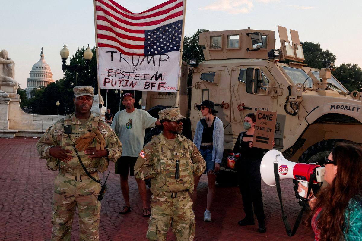 Protesters confront members of the National Guard patrolling Union Station, after U.S. President Donald Trump deployed the National Guard and ordered an increased presence of federal law enforcement to assist in crime prevention, with the U.S. Capitol building in the background, in Washington, D.C., U.S., August 16, 2025. - REUTERSPIX
