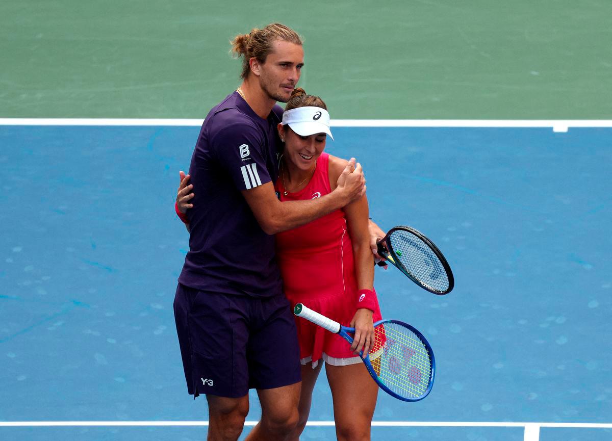 Germany’s Alexander Zverev and Switzerland’s Belinda Bencic react after losing their round of 16 mixed doubles match against Christian Harrison of the U.S. and Danielle Collins of the U.S. REUTERS/Kylie Cooper